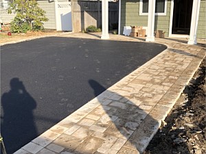 nicolock chesapeake walkway along driveway flat pavers flush with asphalt blacktop